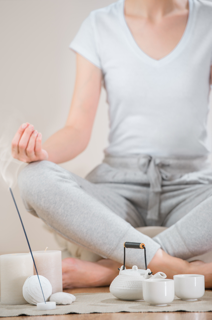 Yoga meditation at home. Relaxation concept with unrecognizable
